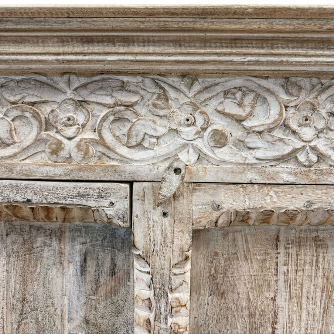 Close-up of the hand-carved detailing on the Durga Wardrobe’s upper panel.