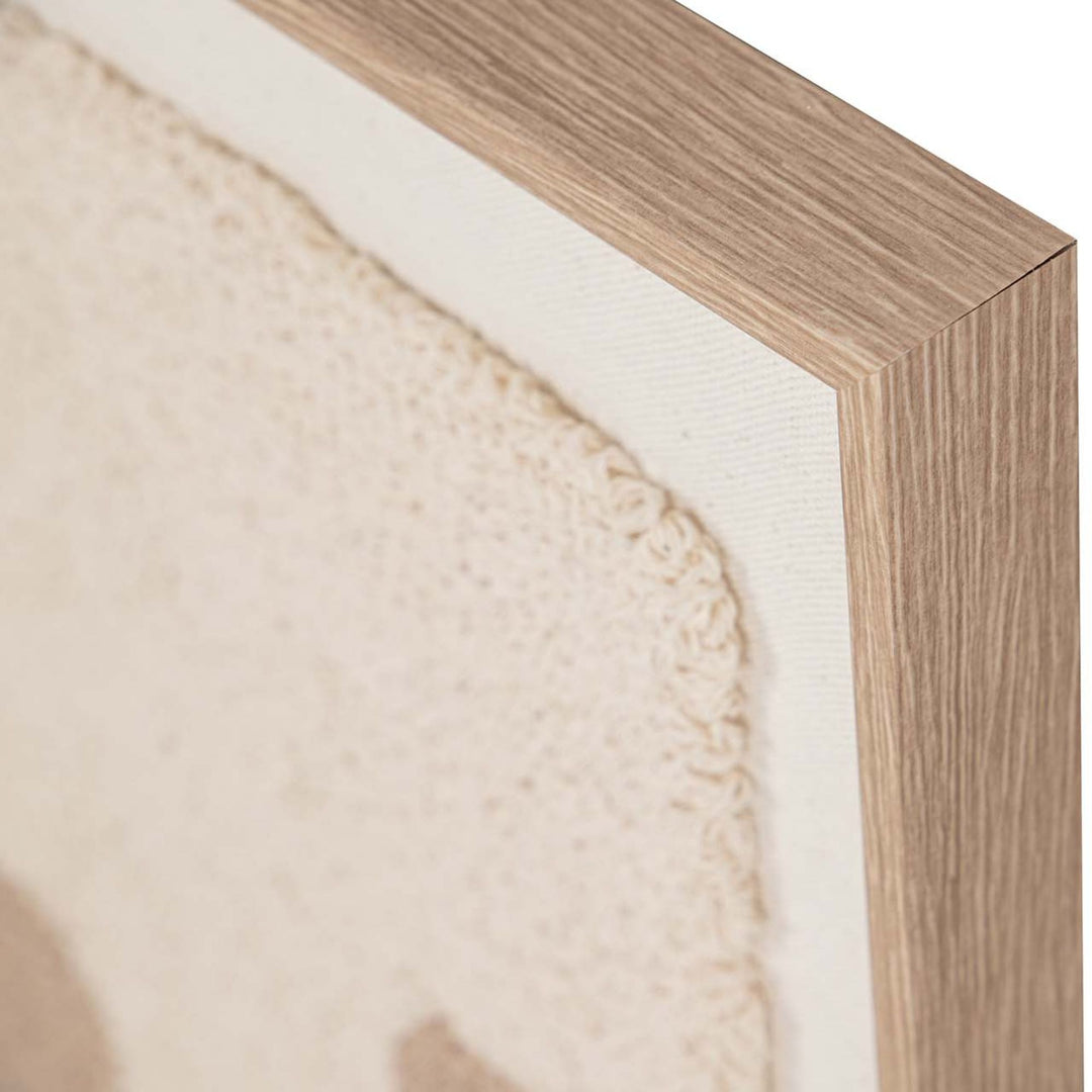 Close-up of the frame corner and fabric edge showing the clean finish and layered textile surface.