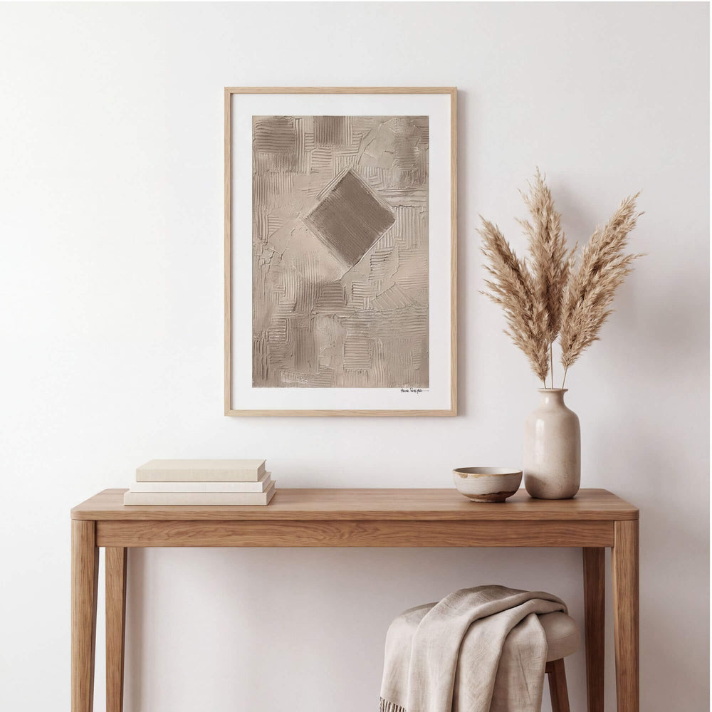 Earth Fragments painting by Manuel Pereyra displayed above a natural wood console in a calm neutral interior