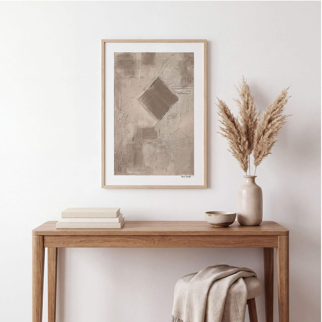 Earth Fragments painting by Manuel Pereyra displayed above a natural wood console in a calm neutral interior