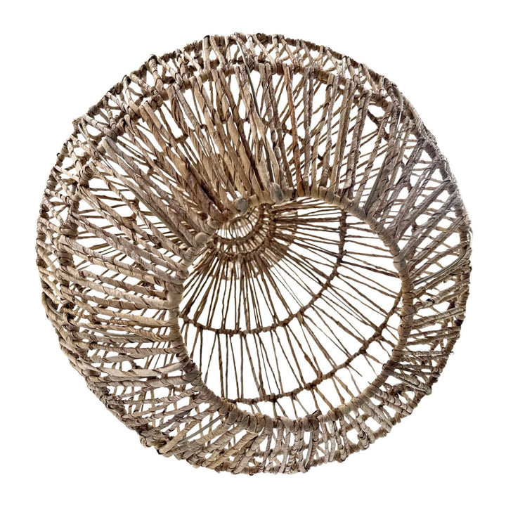 Perspective from below highlighting lamp’s round woven structure.