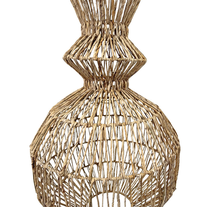 Handwoven banana fiber lamp highlighting bulbous bottom shape