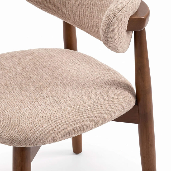 Close-up of the Elara dining chair showing the chenille upholstered seat and curved backrest