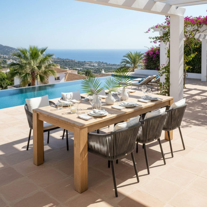 Terrace dining scene with the Ellen Garden pine table and outdoor chairs.