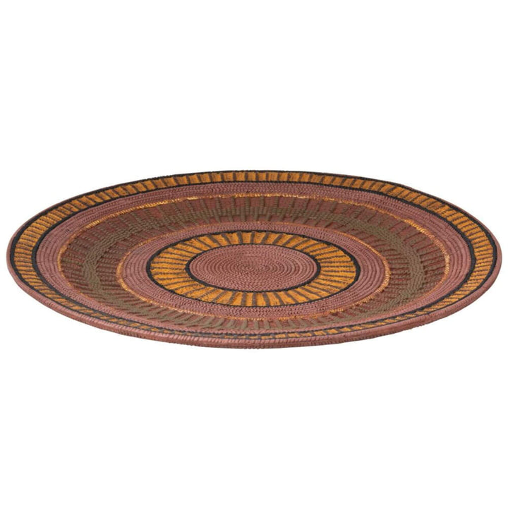 Round ethnic platter with multicolor concentric patterns
