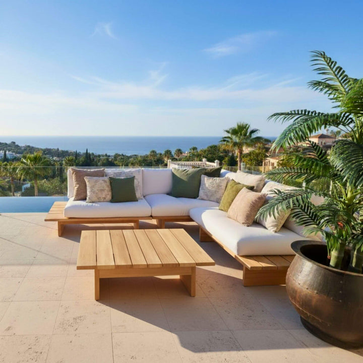 Full view of the eucalyptus wood outdoor sofa set arranged on a bright terrace.