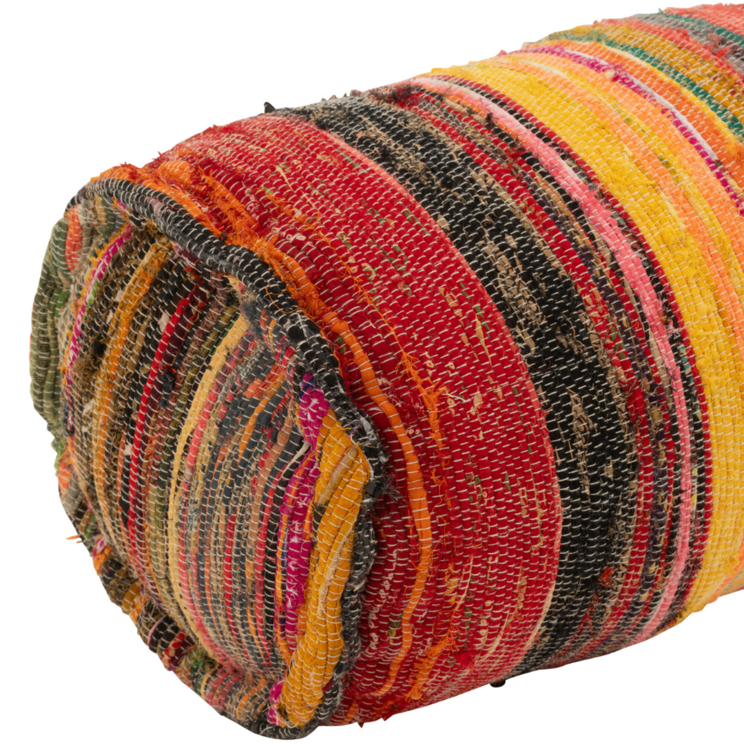 Close-up of Farsha chindi bolster cushion showing colourful chindi weave texture