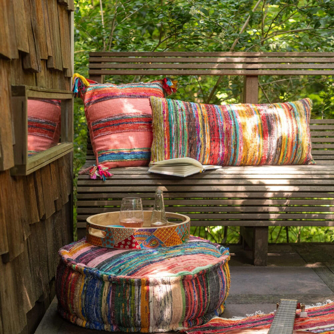 Textured chindi cushions in vibrant mixed tones in an outdoor living area