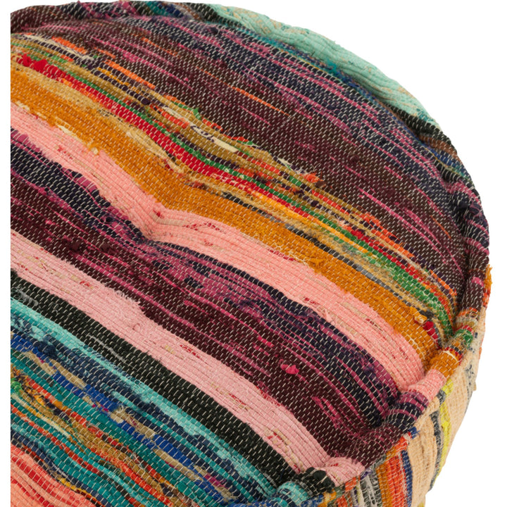 Detailed corner view of striped chindi fabric on round pouf
