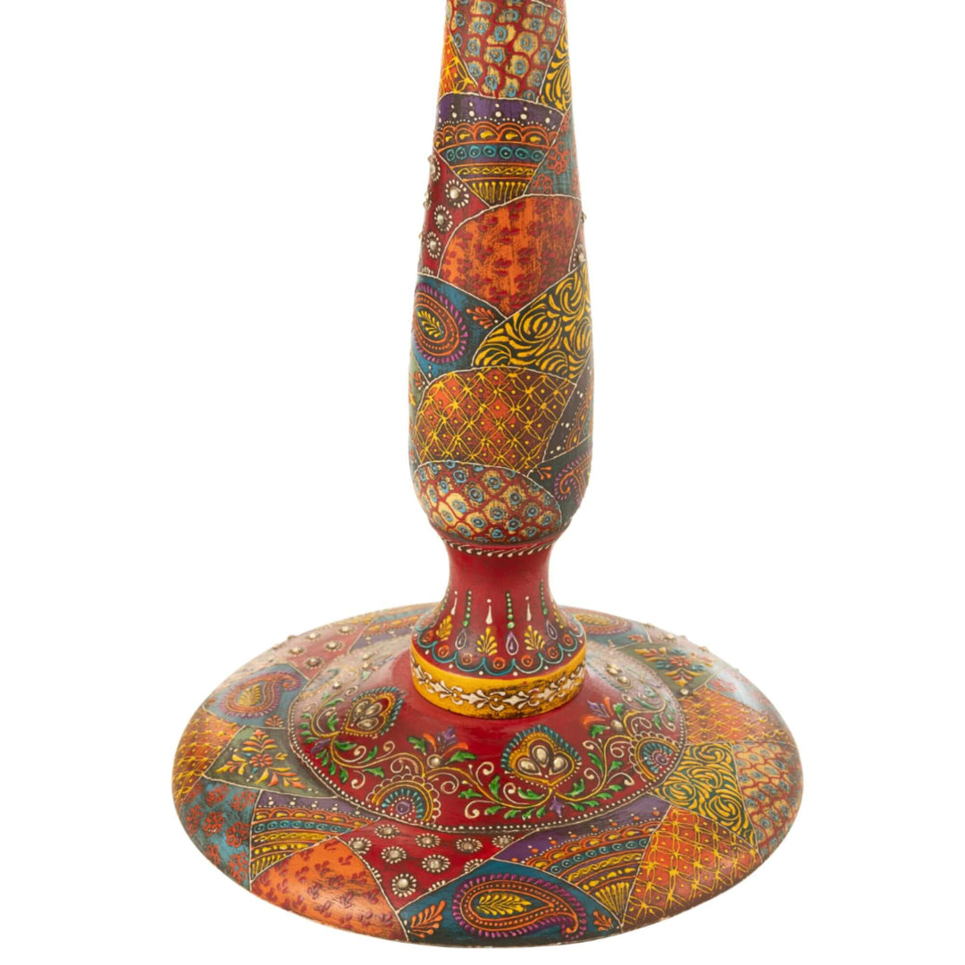 Close-up detail of hand-painted base with floral and paisley motifs on Farsha side table