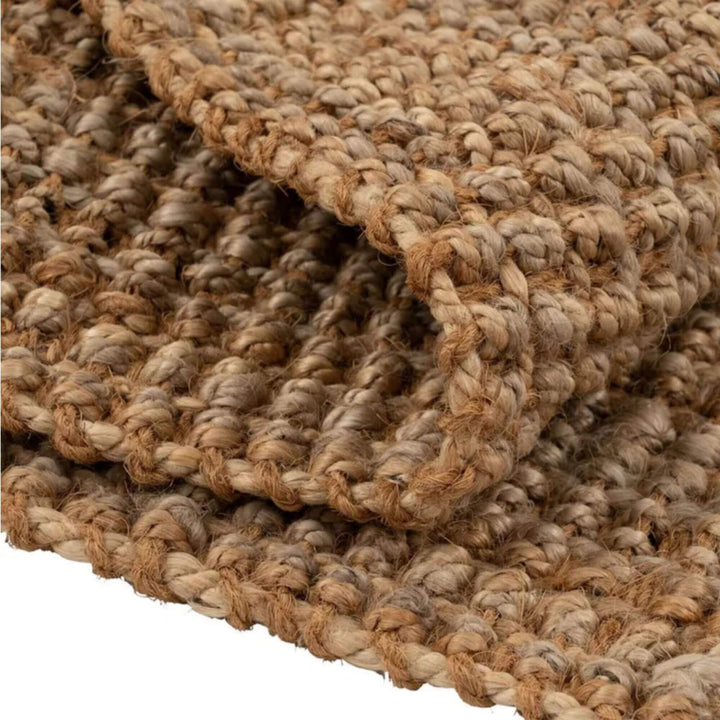 Close-up of the Fati rug showing its thick natural jute fibers and richly textured weave
