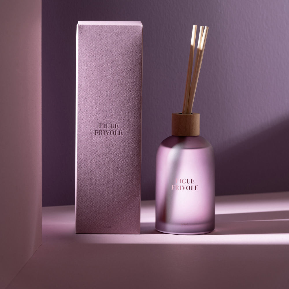 Lifestyle scene featuring the Figue Frivole Diffuser on a shelf with soft lighting.