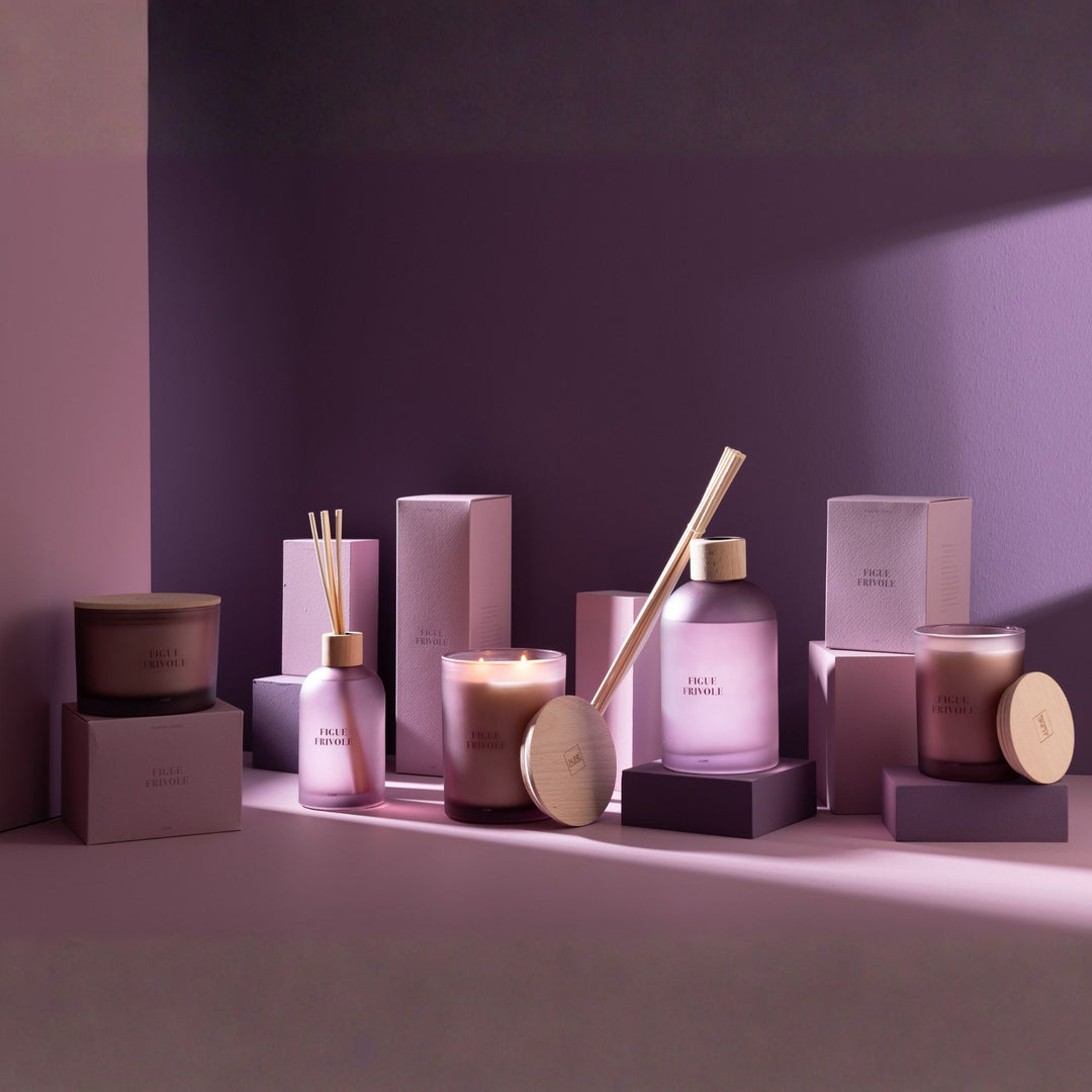 Figue Frivole candle collection arranged with diffusers and accessories.