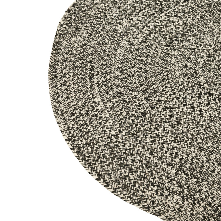 Close-up of the Fiona rug showing its textured braided surface.