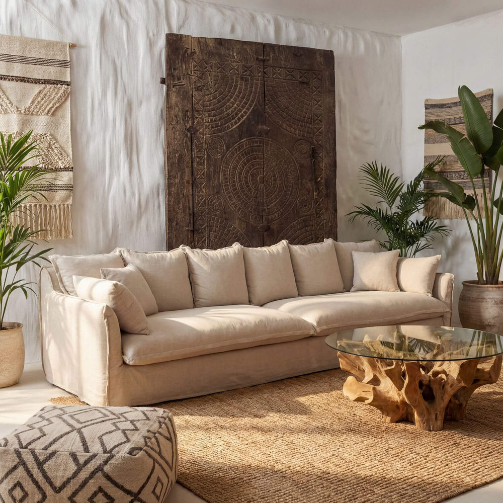 Beige Firenze sofa in a living room with decorative elements and plants.