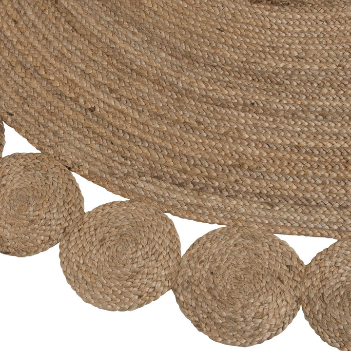 Close-up of the woven jute texture and decorative edging of the Flor Round Jute Rug.