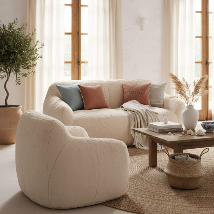 Cozy lounge setting featuring the creme Fluff Sofa with natural décor.
