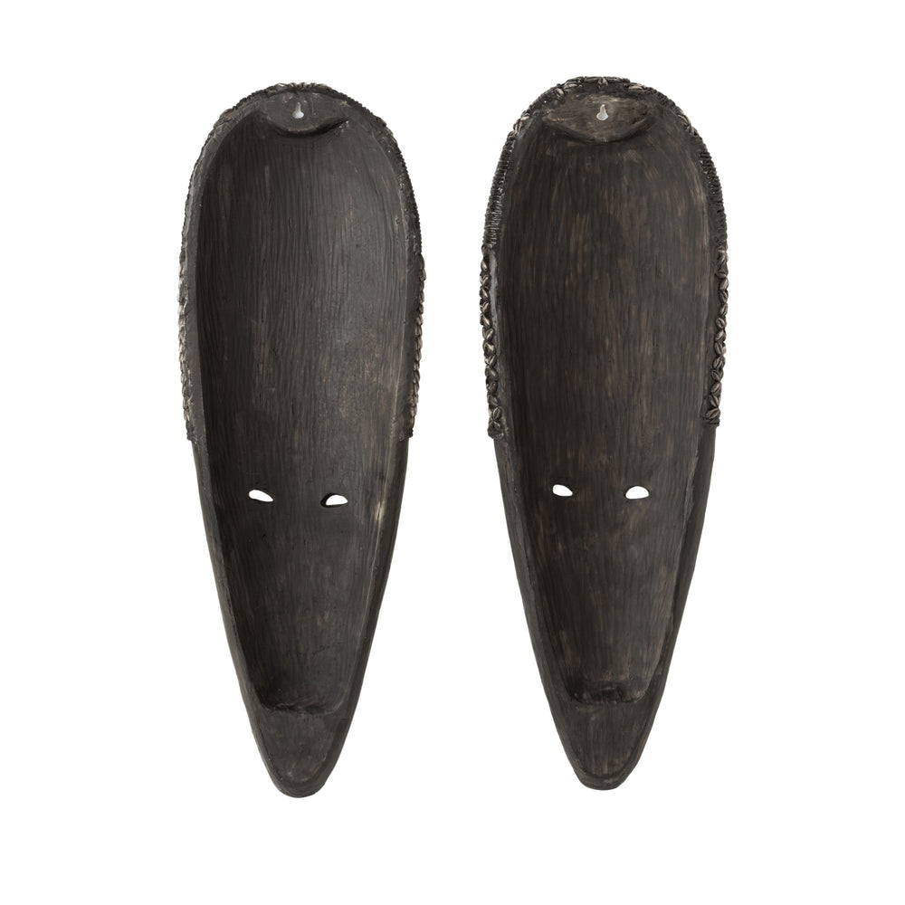 Pair of Frailes wood masks displayed side by side highlighting handcrafted texture and recycled materials.