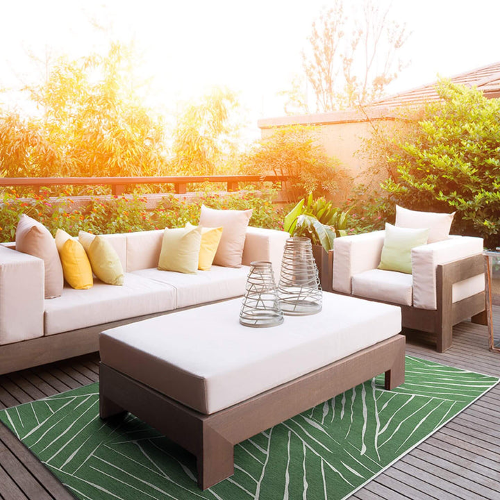 Terrace setting with the Freek outdoor rug under outdoor furniture.
