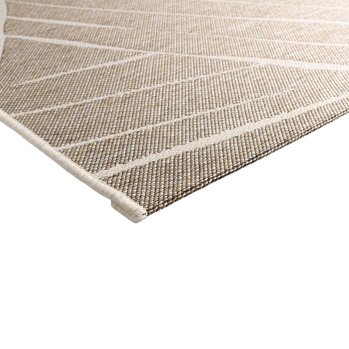 Close-up of the Freek rug showing the polypropylene texture and raised pattern.