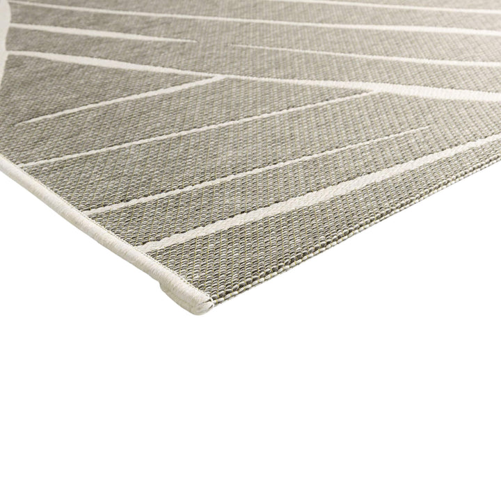 Close-up of the Freek rug showing the polypropylene texture and raised pattern.