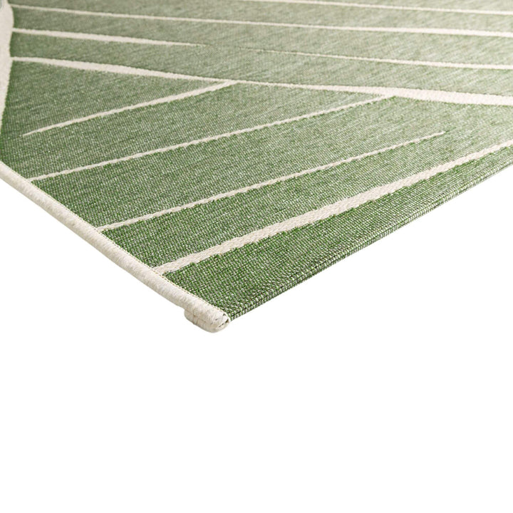 Close-up of the Freek rug showing the polypropylene texture and raised pattern.