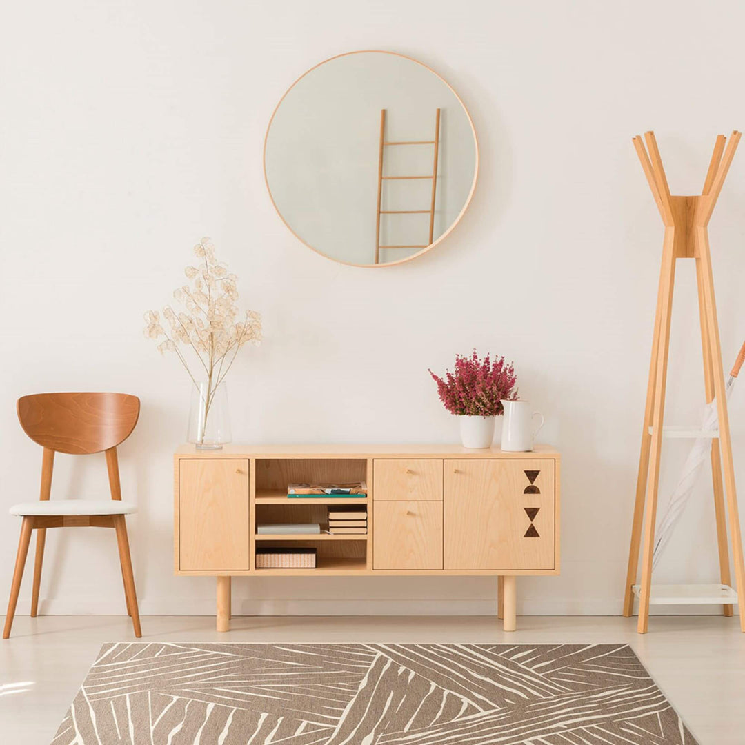 Taupe Freek outdoor rug with modern intersecting line design.