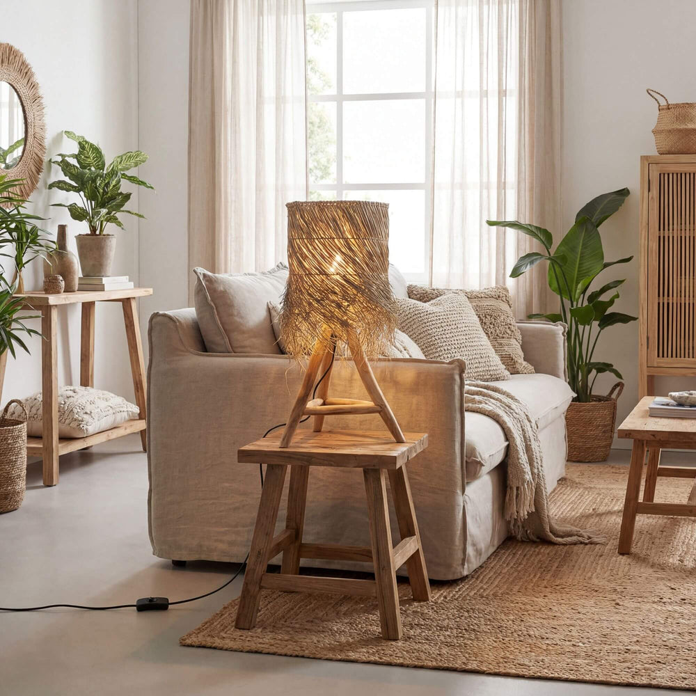 Cozy living room with beige sofa, Fury table lamp, and plants