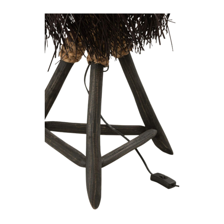 Decorative Fury table lamp with black fringed shade on a white background