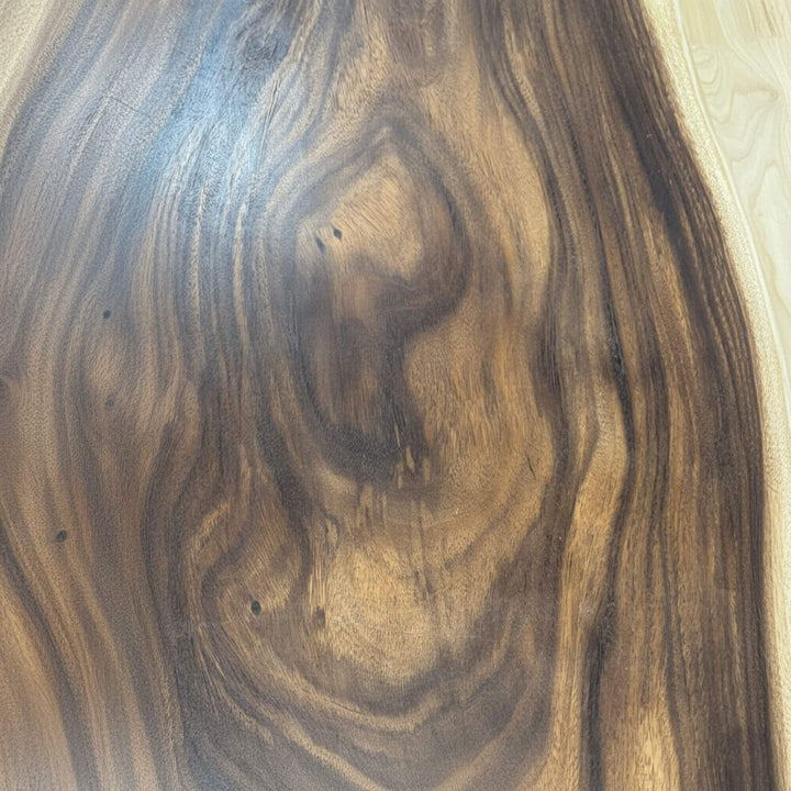 Close-up of the Gaadhoo Coffee Table top highlighting rich suar wood grain patterns.