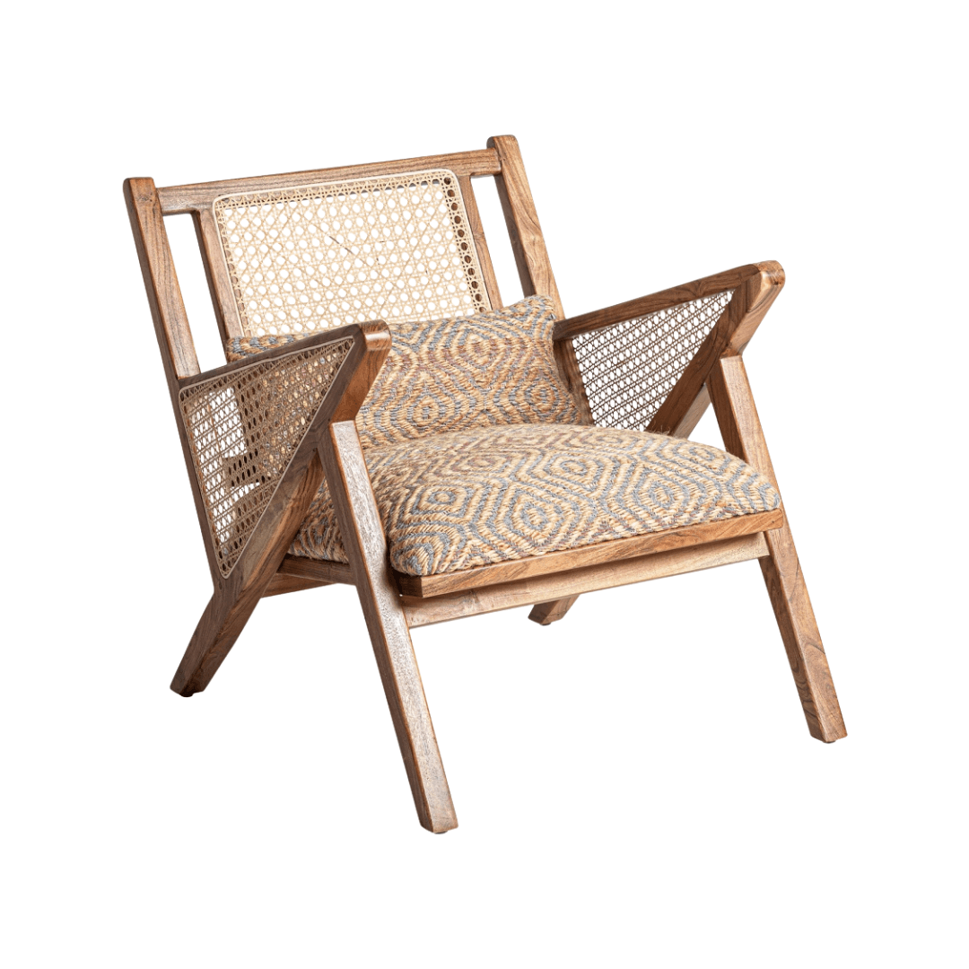 Three-quarter view of Ganda lounge chair with patterned cushion and natural materials