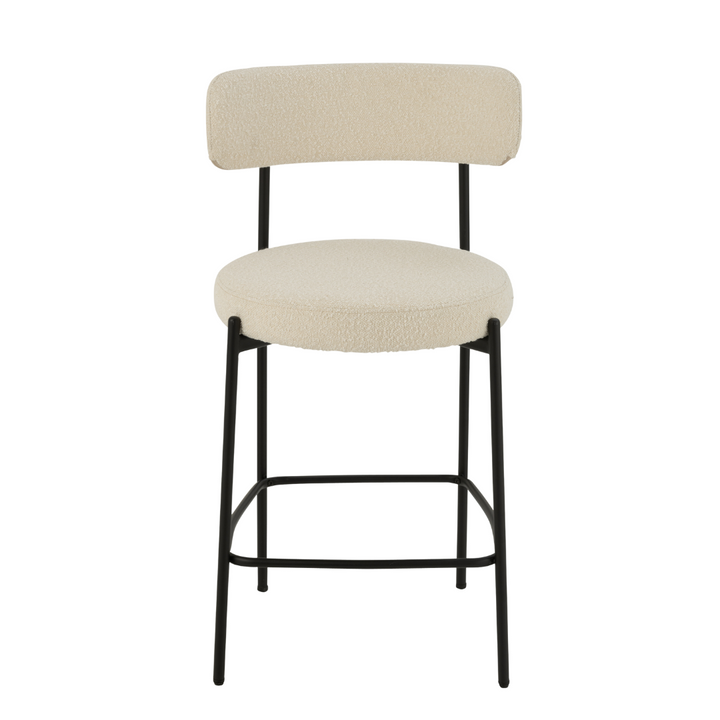Front view of Gelia Bar Stool with upholstered seat and backrest in light fabric and black metal frame.