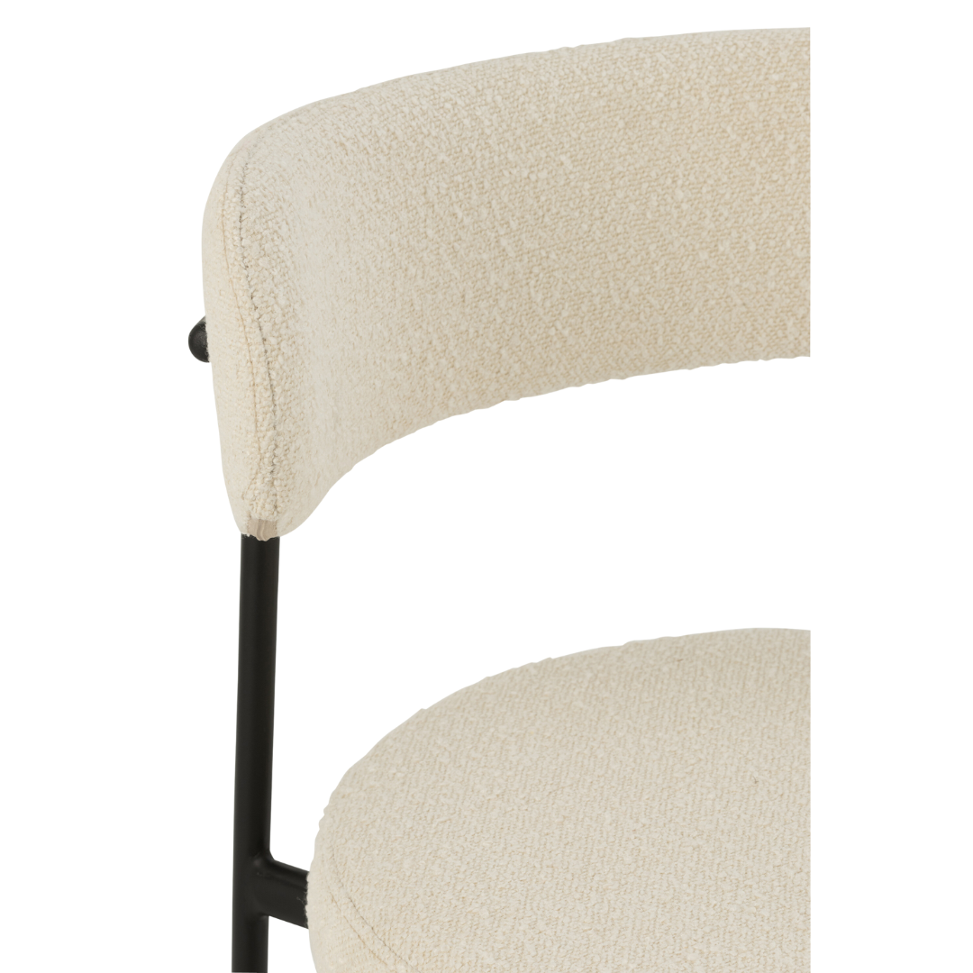 Close-up of a Gelia Bar Stool with beige cushioned backrest and seat on a white background