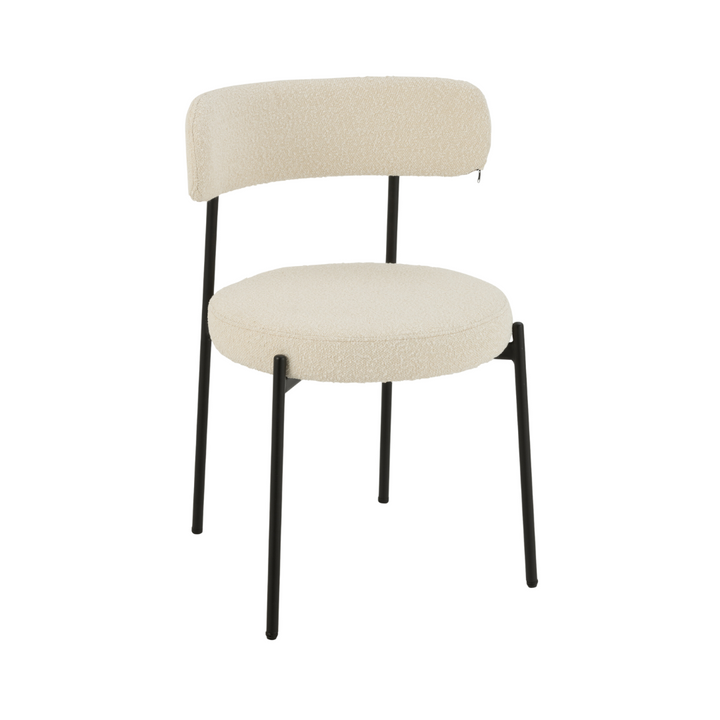 Front view of the Gelia dining chair showing its upholstered seat and curved backrest.