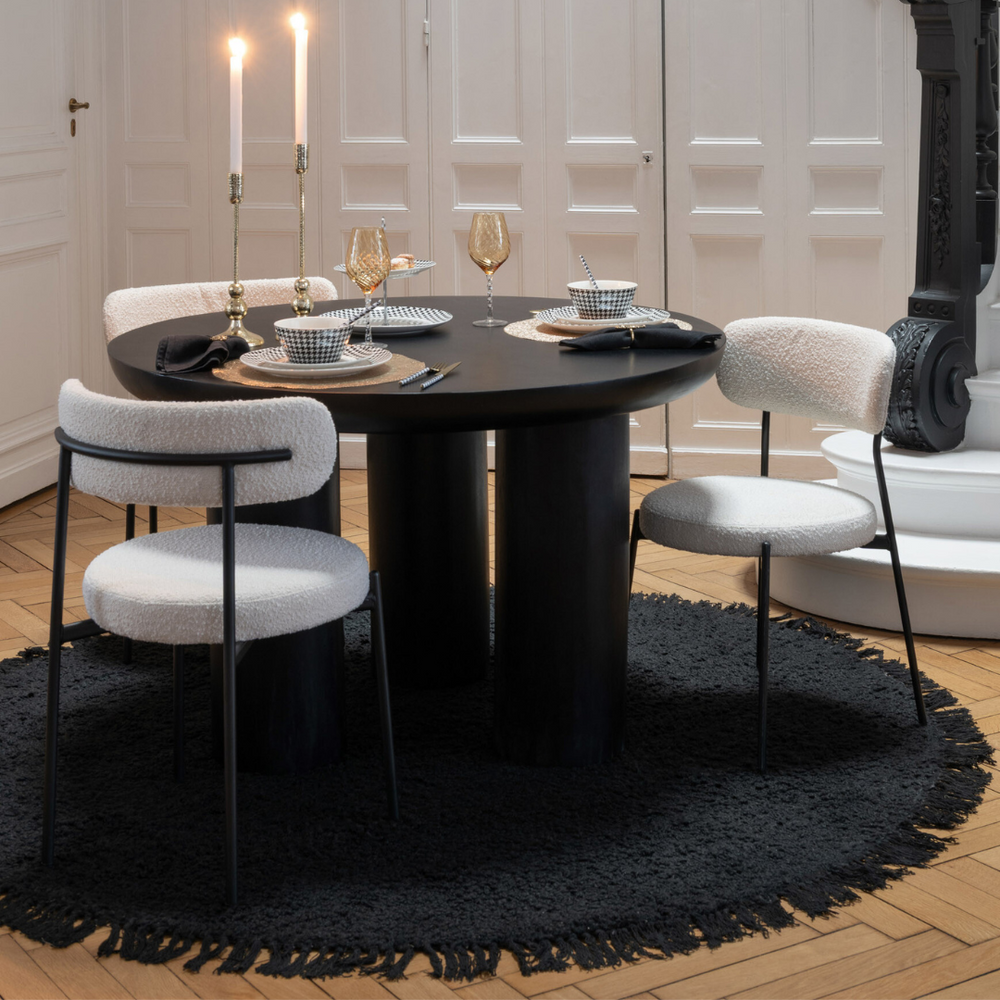 Styled dining setting featuring Gelia dining chairs around a modern dining table.