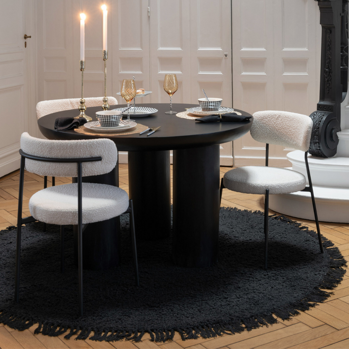 Styled dining setting featuring Gelia dining chairs around a modern dining table.