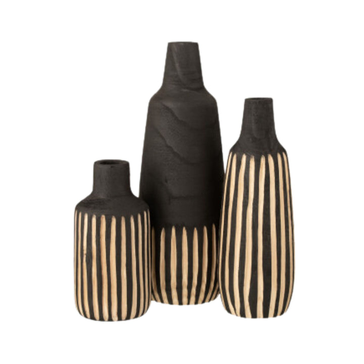 Group display of Ghana vases in different sizes styled on shelving.