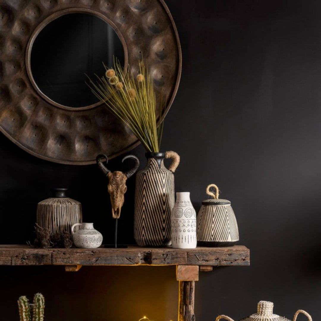 Styled scene featuring the Ghana Ethnic Vase with coordinating ethnic ceramic pieces.
