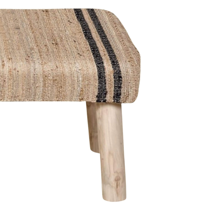 Close-up of the Ghana Jute Bench highlighting the woven jute texture, black stripe detail, and wooden leg