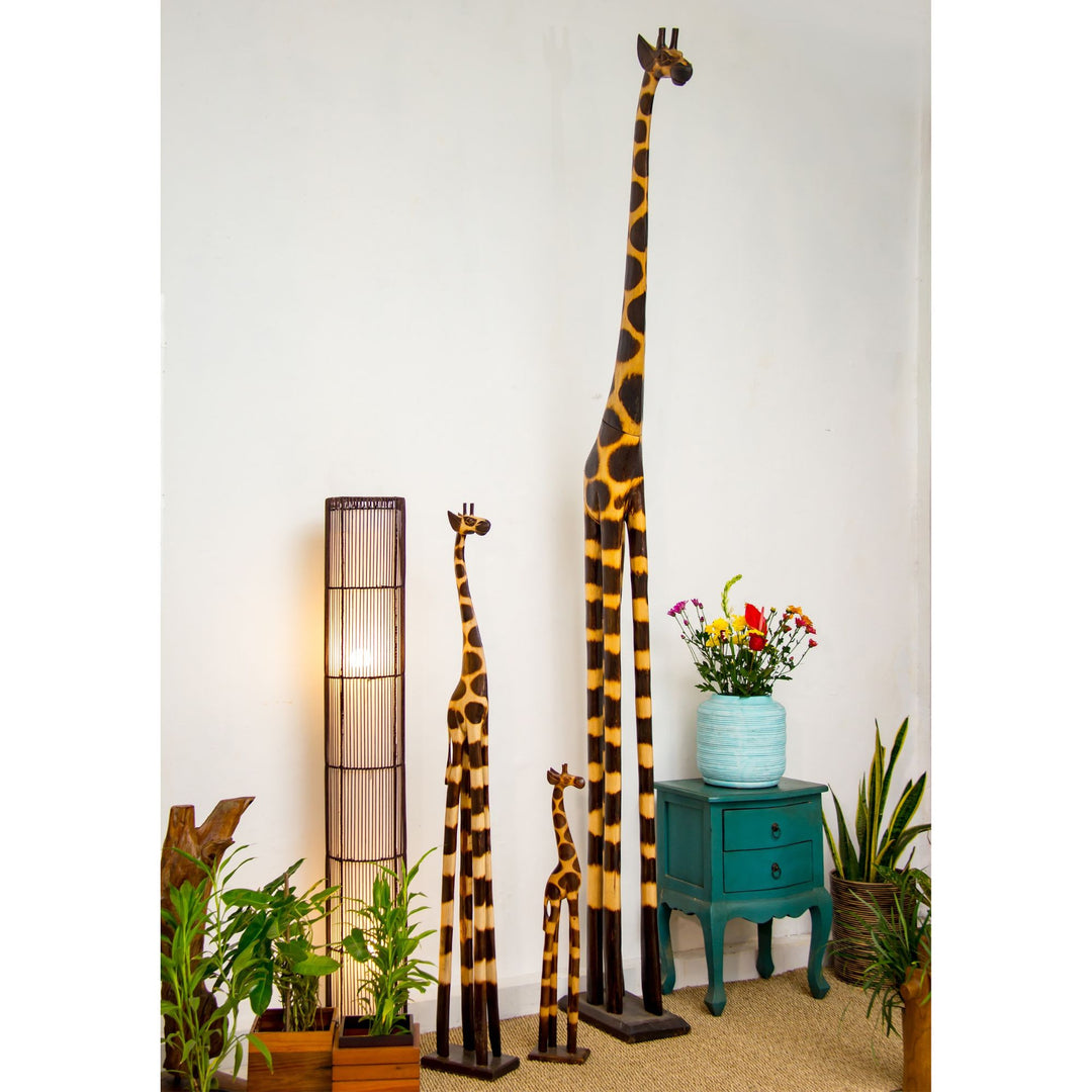 Tall handcrafted giraffe sculpture made from albasia wood with hand-painted pattern.