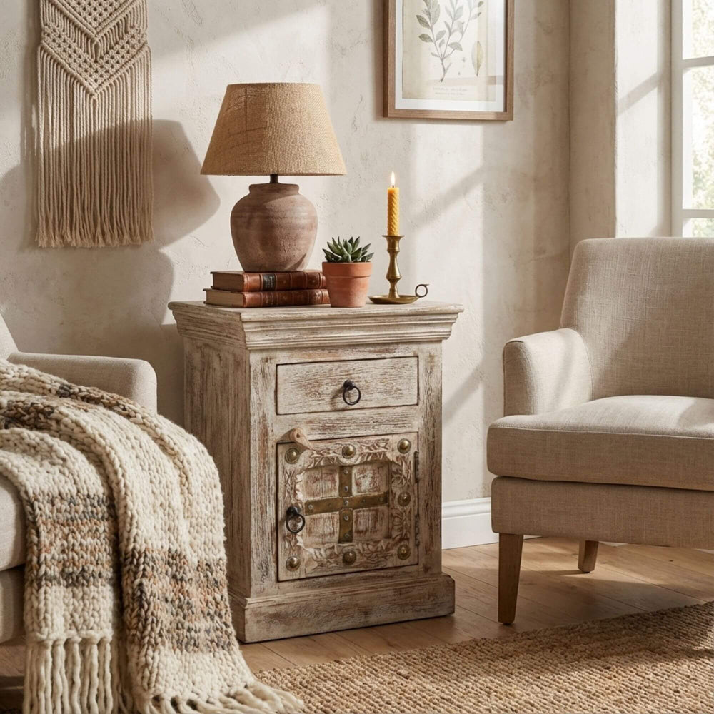 Styled bedroom scene featuring the Golden India Collection bedside table next to a bed.