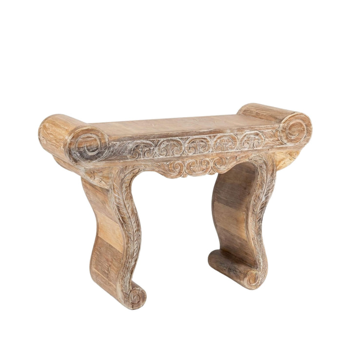 Angled view of the Gopala carved teak wood console table emphasizing its artisanal craftsmanship and reclaimed wood texture.