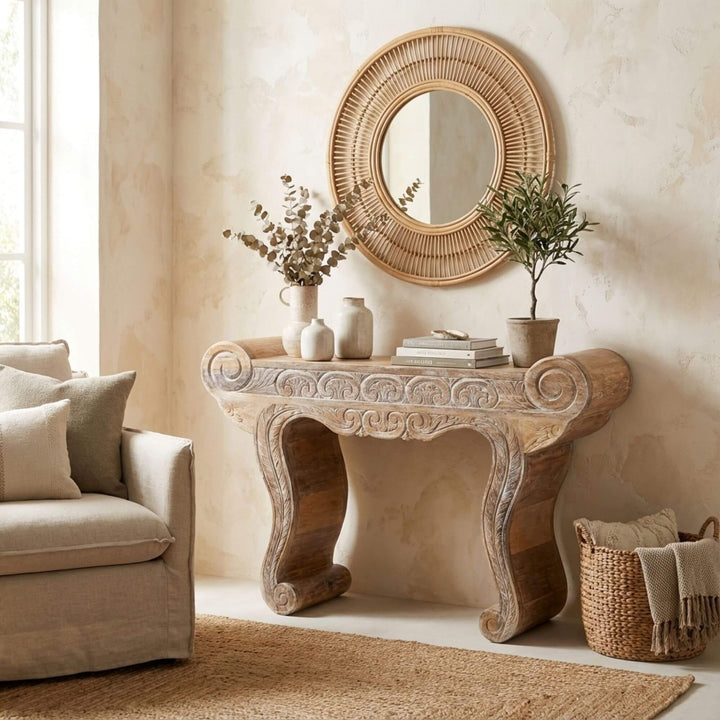 Styled interior view of the Gopala console table placed beneath a round mirror in a warm, natural setting.