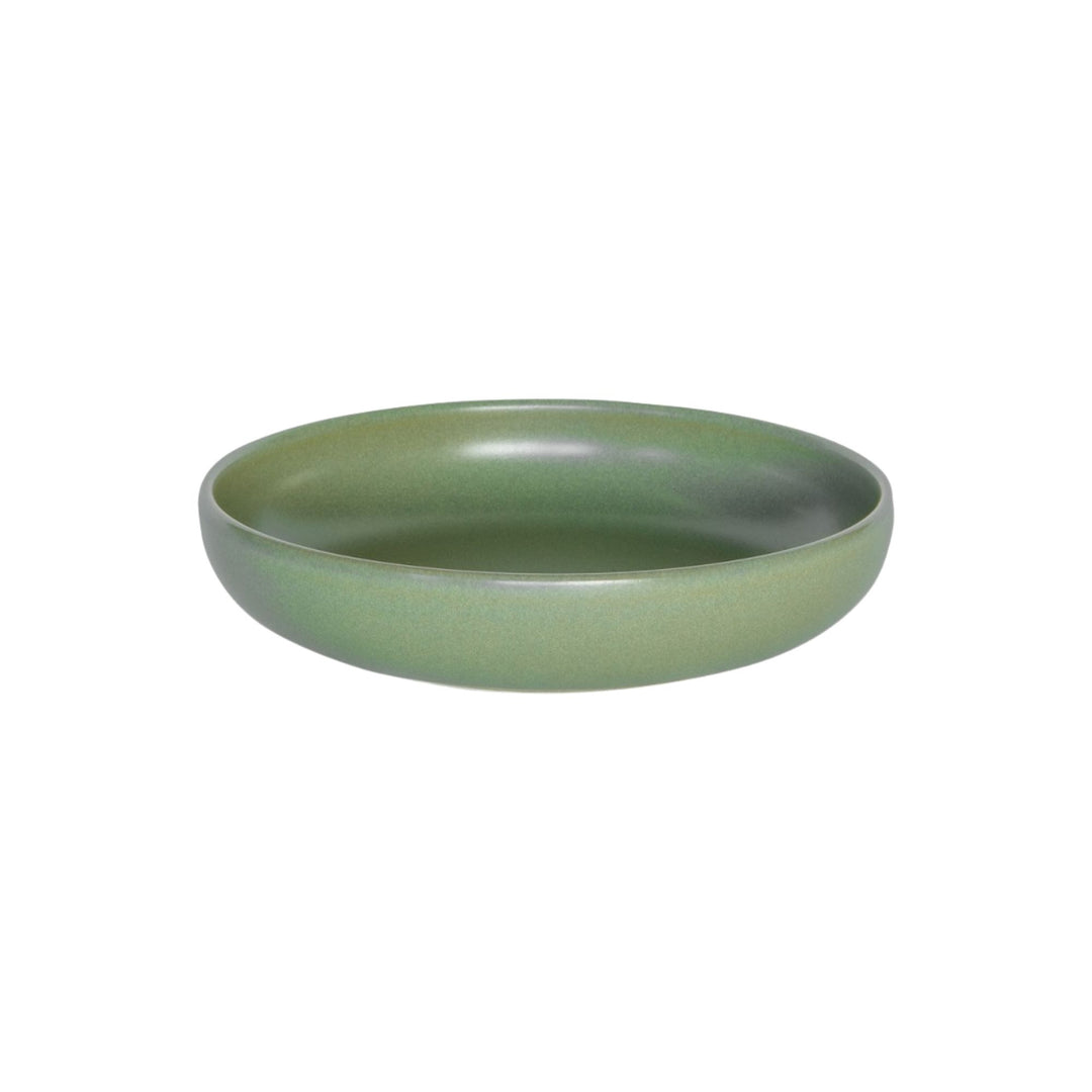 Green ceramic soup bowl from the Amande collection with rounded shape.