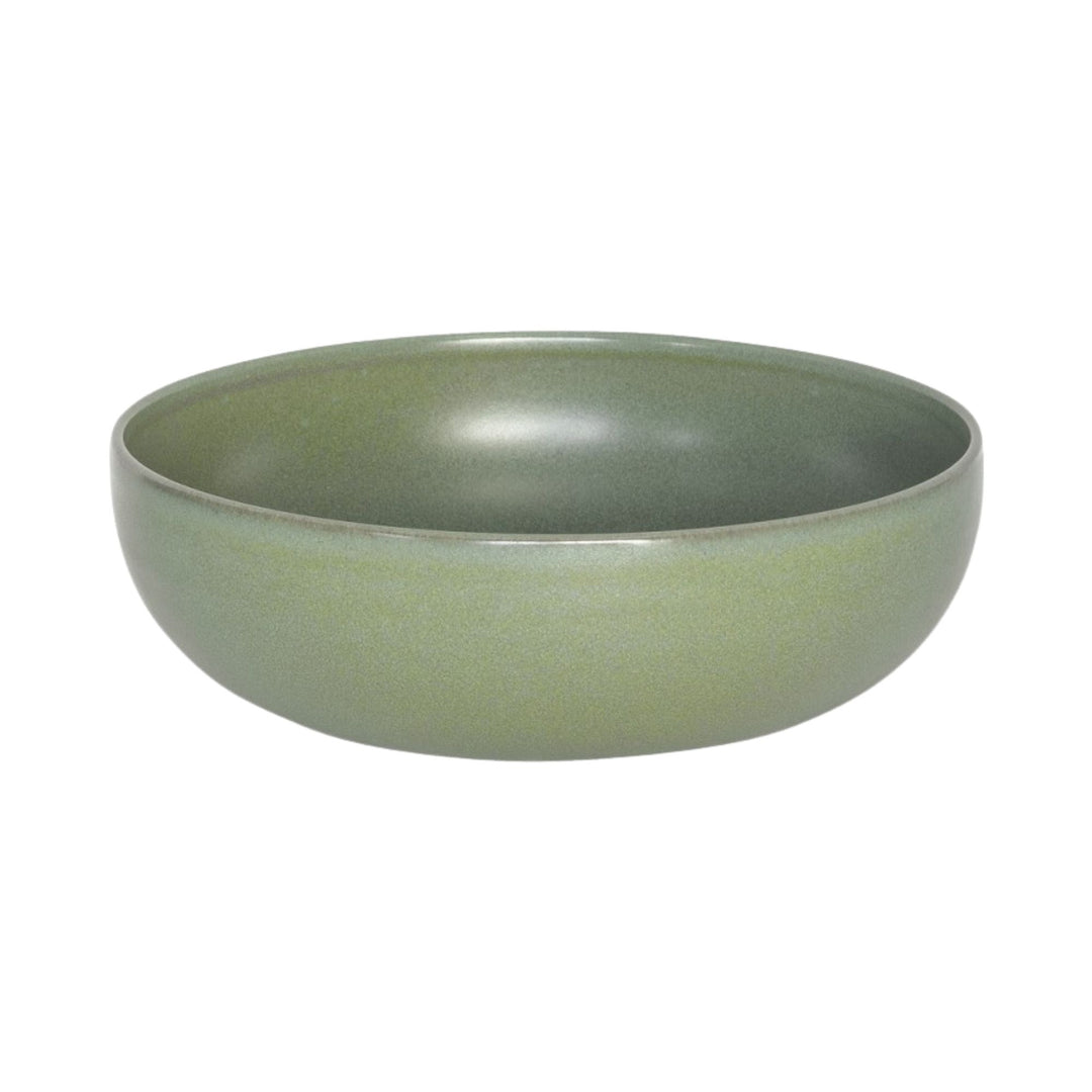 Green ceramic Saladier from the Amande collection with rounded shape.