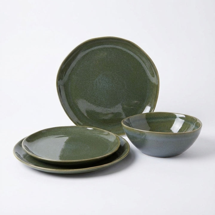 Green Symphony ceramic tableware set with plates and bowl in soft green glaze.