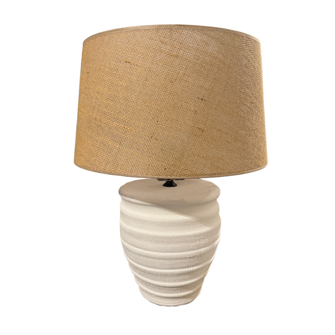 Griega table lamp with natural jute shade and ridged white ceramic base.