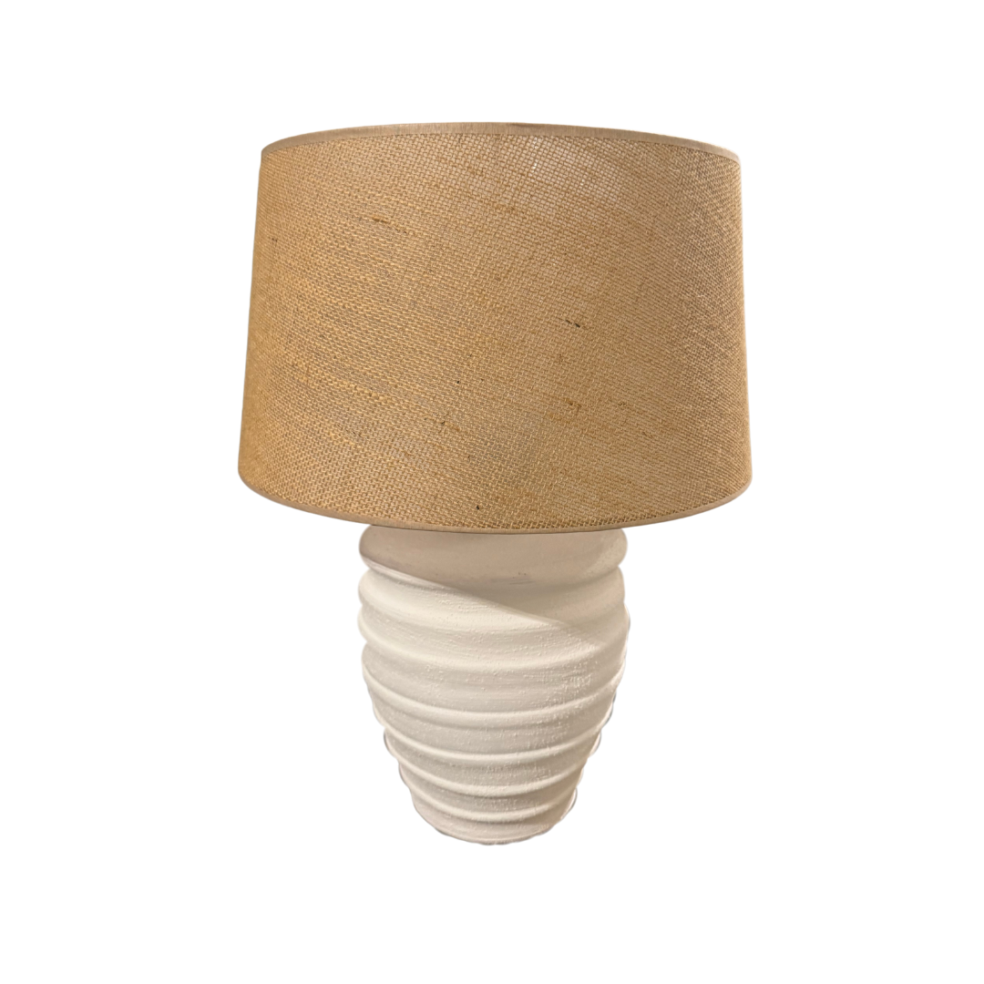 Griega lamp showcasing textured ceramic base and jute drum shade