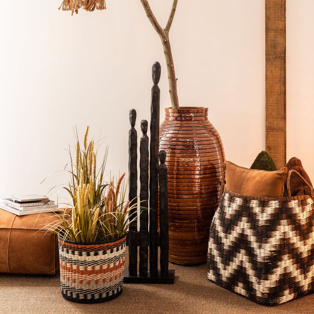Interior styling view with the Grupi wood figure placed on the floor.