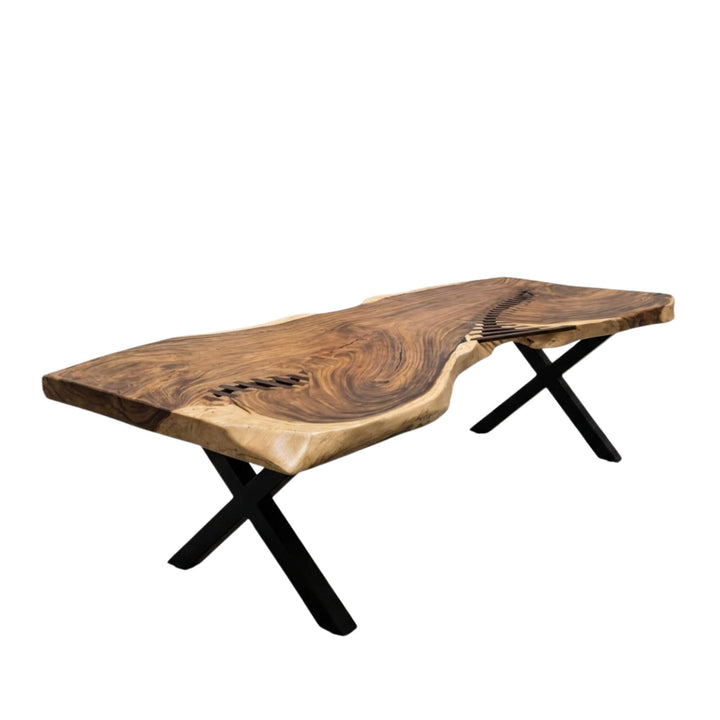 Front view of Gunung suar dining table highlighting its live-edge top and black metal legs.